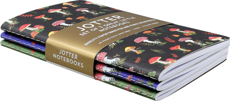 Set of three mini notebooks with colorful mushroom designs and gold foil accents on black, blue, and green covers
