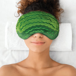 Eye Pillow | Dilly Dally Pickle green plush pickle eye pillow worn over closed eyes during relaxation