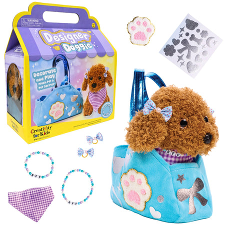 Plush brown dog in blue carrier with decorative patches, accessories, and play kit for kids to customize and care for pet toy.