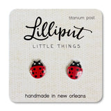 Ladybug Earrings with red and black design on titanium posts, handmade in New Orleans, lightweight and hypoallergenic.