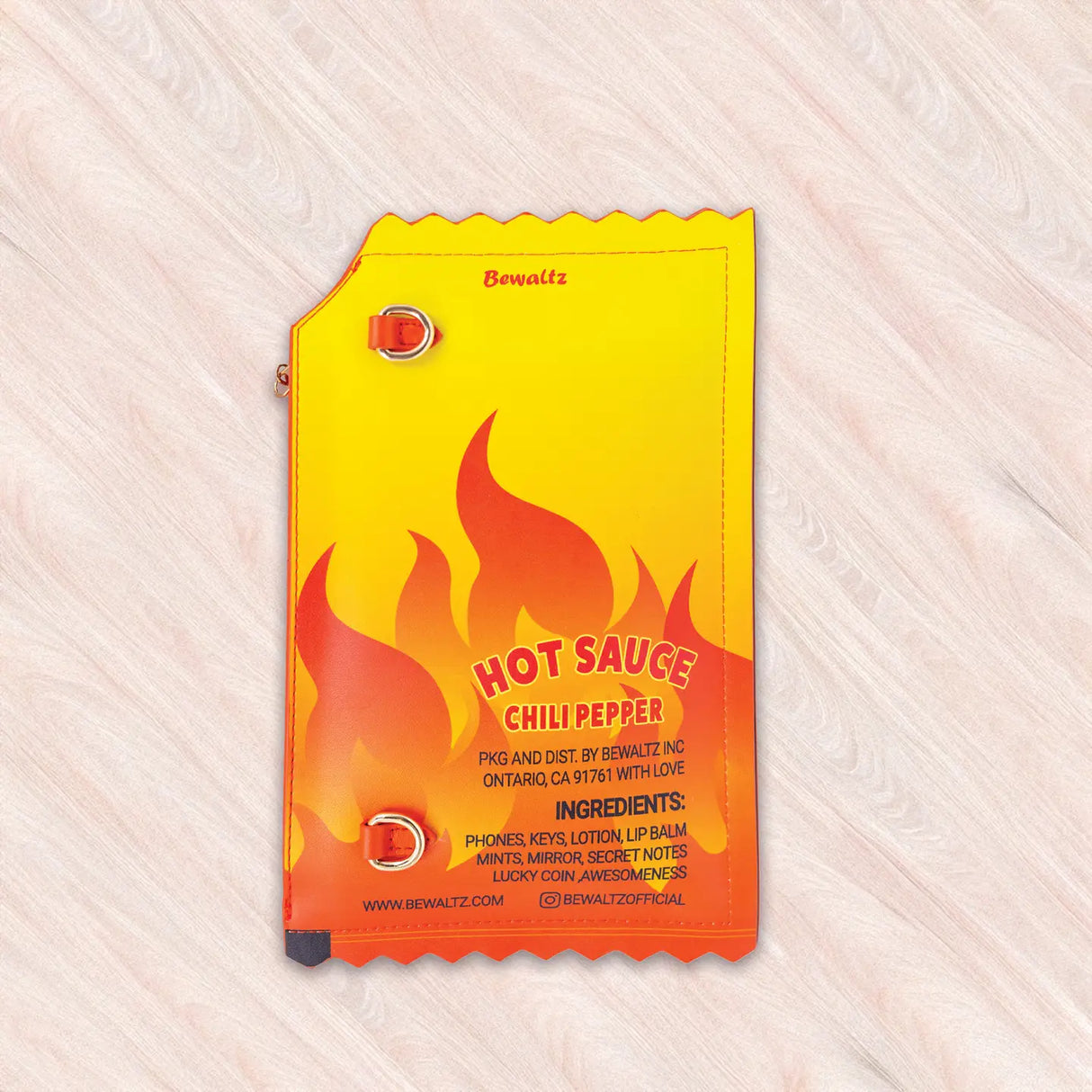 Crossbody Handbag | Hot Sauce shaped like a vibrant hot sauce packet with flame design and playful details.