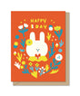 Bright orange birthday card featuring a cute white bunny surrounded by colorful flowers and cheerful text.