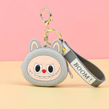 Labubu Head Coin Purse with cheerful face and keychain strap labeled BOOM for carrying coins securely.
