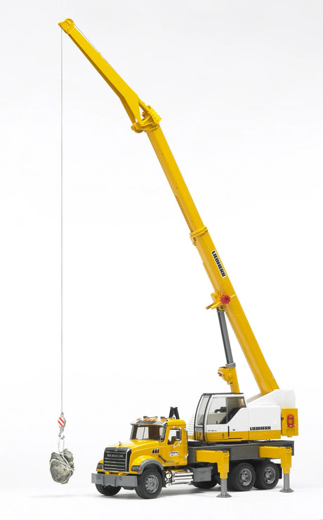 MACK Granite Liebherr Crane Truck with extended boom lifting a load, detailed cab, and outriggers for stability