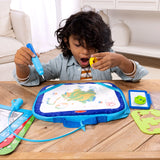 Child using a Water WOW! drawing set with colorful water-reveal board and activity cards on wooden table