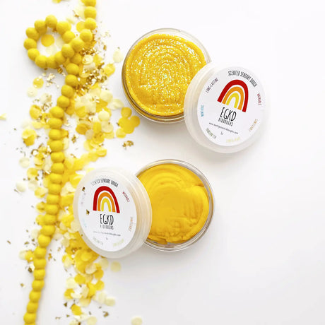 KidDough Glitter | Yellow sensory dough with glitter in containers, soft and pliable for creative play.