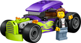 Bright green and purple hot rod toy car with flame decals and a driver minifigure standing next to it