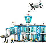 Toy airport building set with control tower, airplane, jet bridge, airport tug, and minifigures for imaginative play