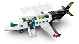 Toy model airplane with open door, foldable stairs, and minifigures seated inside for imaginative play.