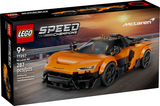 Orange race car model with detailed design and a mini driver figure in racing gear on a racetrack background