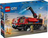 Colorful building block fire truck toy with extendable water cannon, opening compartments, and firefighter figures on an airport runway background