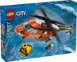 LEGO City sea rescue helicopter with pilot hook lowering rescue capsule and shark in ocean playset box.