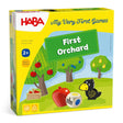 HABA First Orchard game box featuring fruit trees, raven figure, colorful wooden fruit, and a color-symbol die on grass background