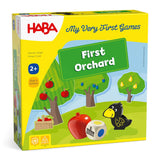 HABA First Orchard game box featuring fruit trees, raven figure, colorful wooden fruit, and a color-symbol die on grass background