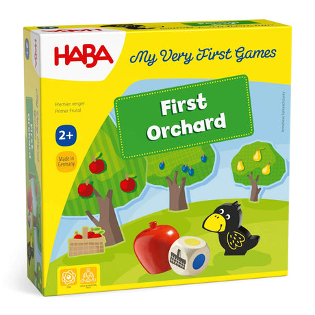 HABA First Orchard game box featuring fruit trees, raven figure, colorful wooden fruit, and a color-symbol die on grass background