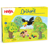 Brightly colored Orchard board game box with trees, fruit, a raven, and a basket on grassy field background