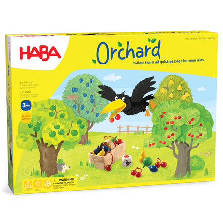 Brightly colored Orchard board game box with trees, fruit, a raven, and a basket on grassy field background