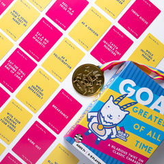 GOAT: Greatest of All Time game box with medal and colorful challenge cards