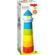 Colorful wooden stacking lighthouse toy with classic minimalist design in tall rectangular packaging box