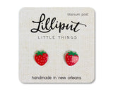 Strawberry Earrings featuring handmade red strawberry studs with titanium posts on a branded card from Lilliput.