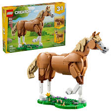 LEGO Creator 3 in 1 Beautiful Horse model with movable joints posed on a grass-effect base next to the product box.