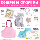 Craft kit with plush gray kitten, pink carrier, blue tutu, gold stickers, flower bracelets, crown, patch, and adoption certificate
