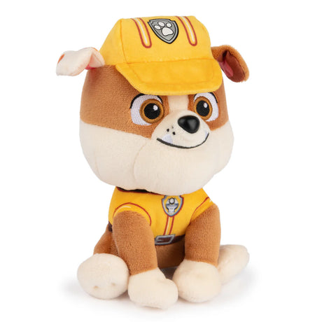 Soft plush toy of a brown and white dog wearing a yellow construction hat and uniform sitting up facing forward