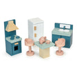 Wooden dollhouse kitchen set with stove, fridge, sink, table, chairs, and tea set in pastel colors