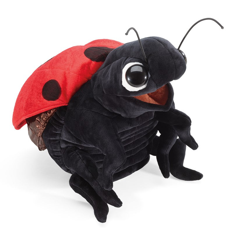 Ladybug Puppet with a black body red spotted wings and expressive eyes