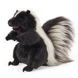 Standing Skunk Puppet with black fur and a fluffy striped tail