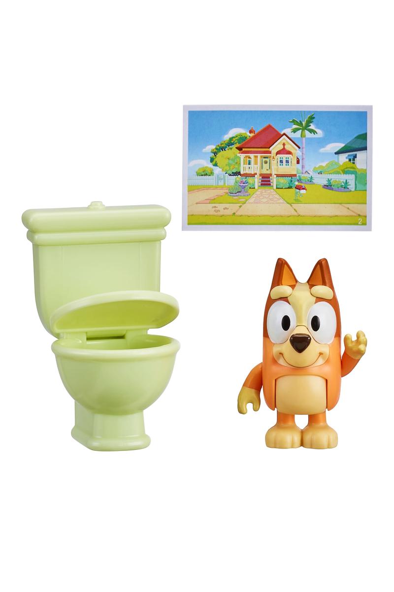Bluey Story Starter Figure Pack Series 9 with interactive Bluey figure, green toilet accessory, and postcard scene from the show.