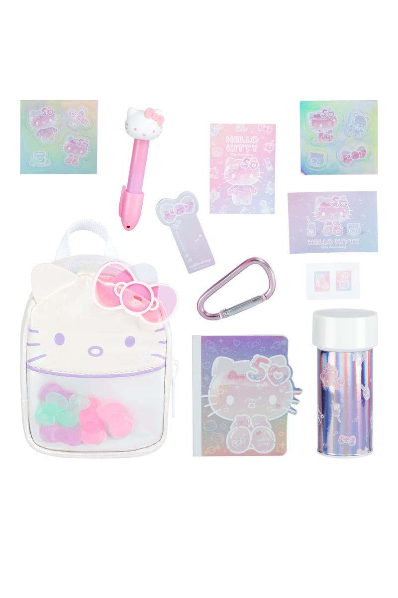 Real Little Hello Kitty Backpack with mini collectible stationery items including pen, stickers, and charms in pastel colors.