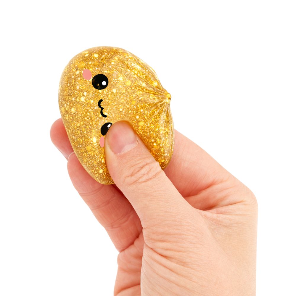 Lucky Bao Dumpling Mini golden glitter dumpling toy held in hand