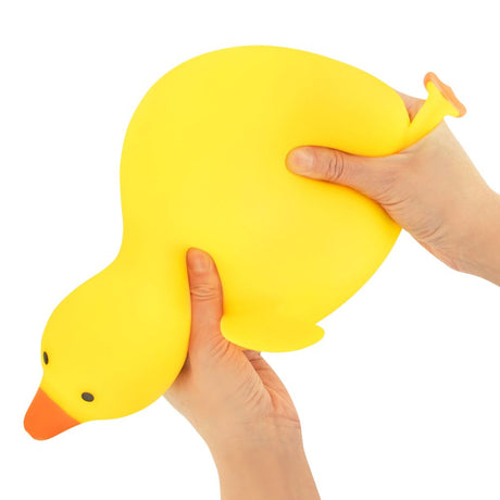 The Big Squij Duck yellow squishy toy held in hands