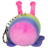 Plush keychain showing the back of a rainbow-striped caterpillar with pink antennae and purple feet