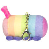 Soft rainbow-striped plush caterpillar keychain with pink antennae and purple feet viewed from the side