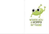 Green cartoon frog with big eyes jumping beside playful birthday greeting text on white background