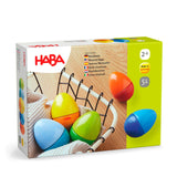 Box of colorful wooden musical eggs for toddlers aged 2 and up, designed for sensory and auditory play.