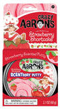 Crazy Aarons Strawberry Shortcake scented putty in pink with strawberry-themed packaging for kids ages 3 and up
