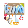 Colorful penguin-themed spiral toy with soft hanging plushes designed to entertain babies on strollers or cribs.