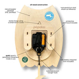 Back view of wooden owl-shaped pendulum clock showing battery compartment and hanging bracket details