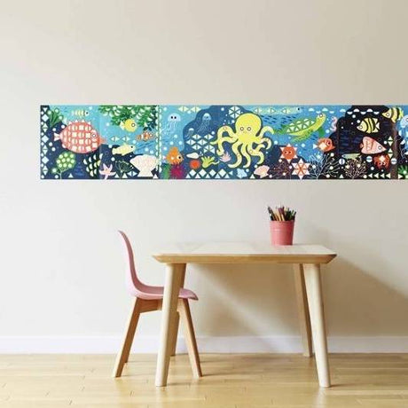 Poppik Sticker Panorama Aquarium colorful underwater scene with tropical fish and marine animals above child’s desk and chair.