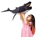 Humpback Whale Puppet held overhead by a smiling child