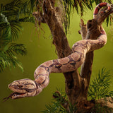 Boa Constrictor Puppet draped around a tree in a jungle setting