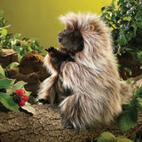Standing Porcupine Puppet perched on a log in a woodland scene