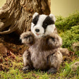Badger Puppet with soft brown fur seated outdoors near a tree