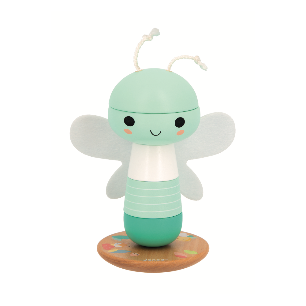 Cute mint green dragonfly stacker toy with smiling face and soft wings on wooden base for toddlers 12 months and up