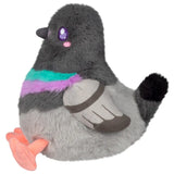 Gray plush bird with purple eyes, colorful striped scarf, wing details, and orange feet posed against a white background