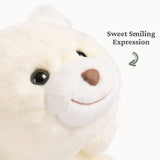 Close-up of a small plush with soft cream fur and a sweet smiling expression for cuddling on the go