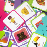 Pile of cards from the game, each with a colorful cartoon illustration and simple description.